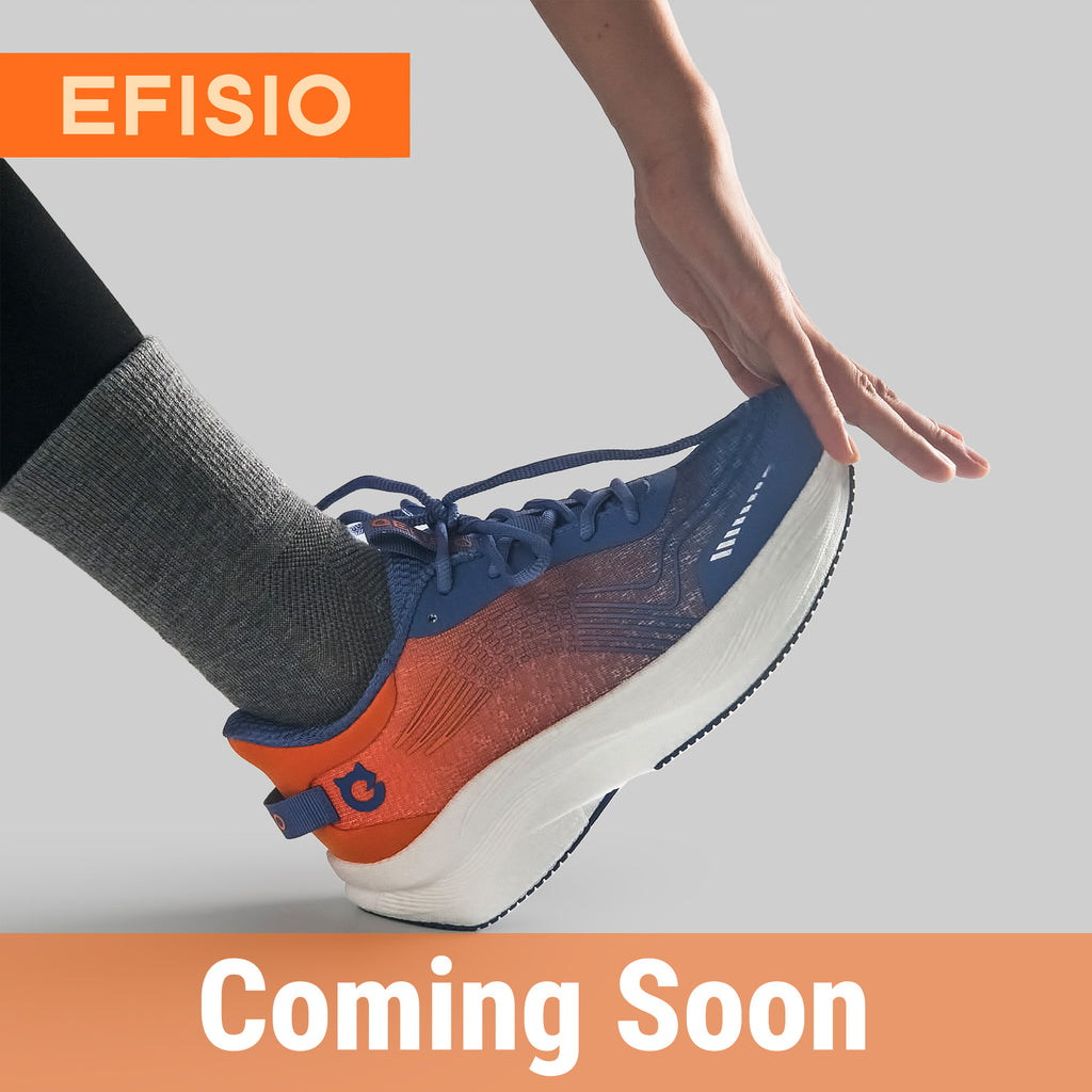 Person wearing a blue and orange EFISIO Airfoil II Athletic Shoe on a light gray background