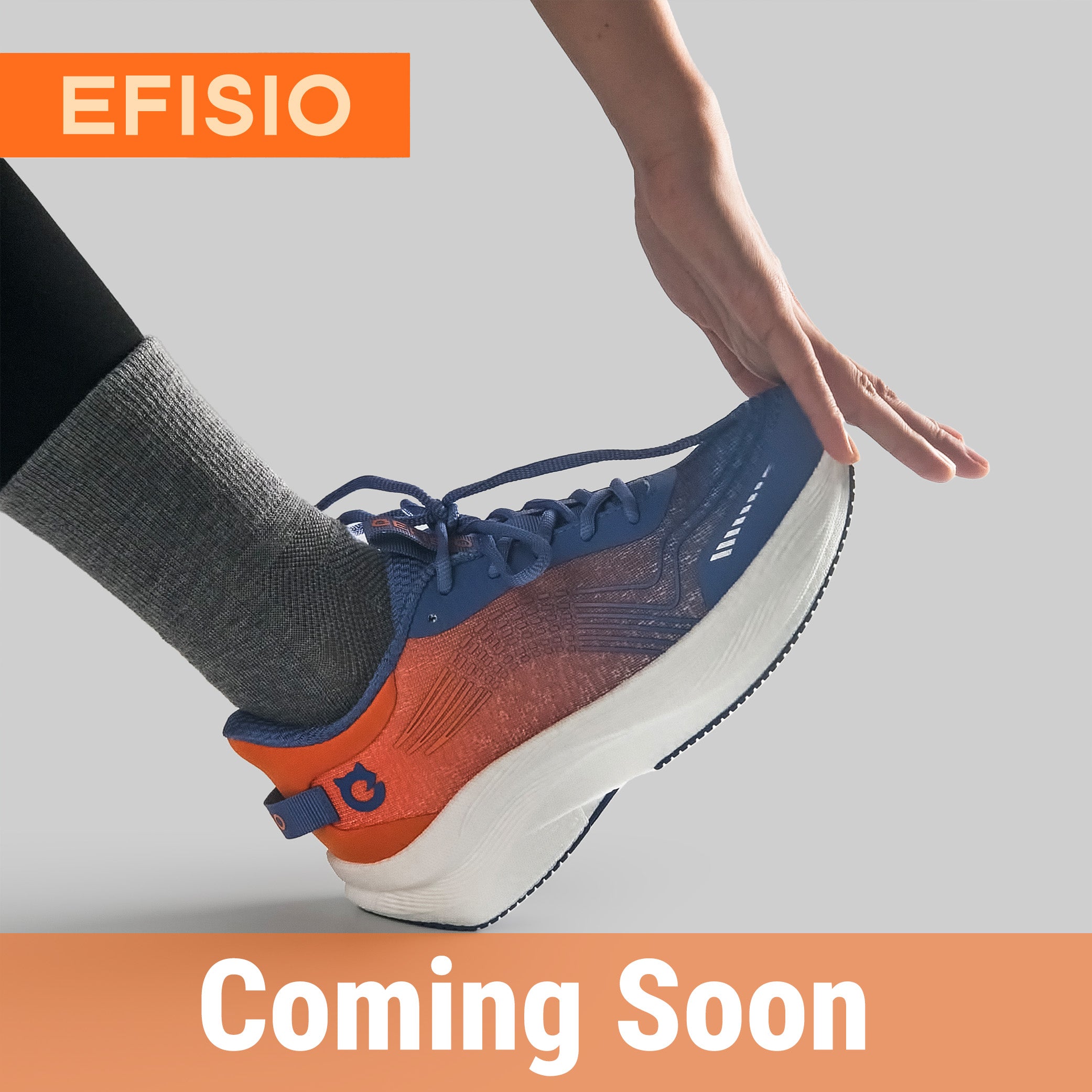 Person wearing a blue and orange EFISIO Airfoil II Athletic Shoe on a light gray background