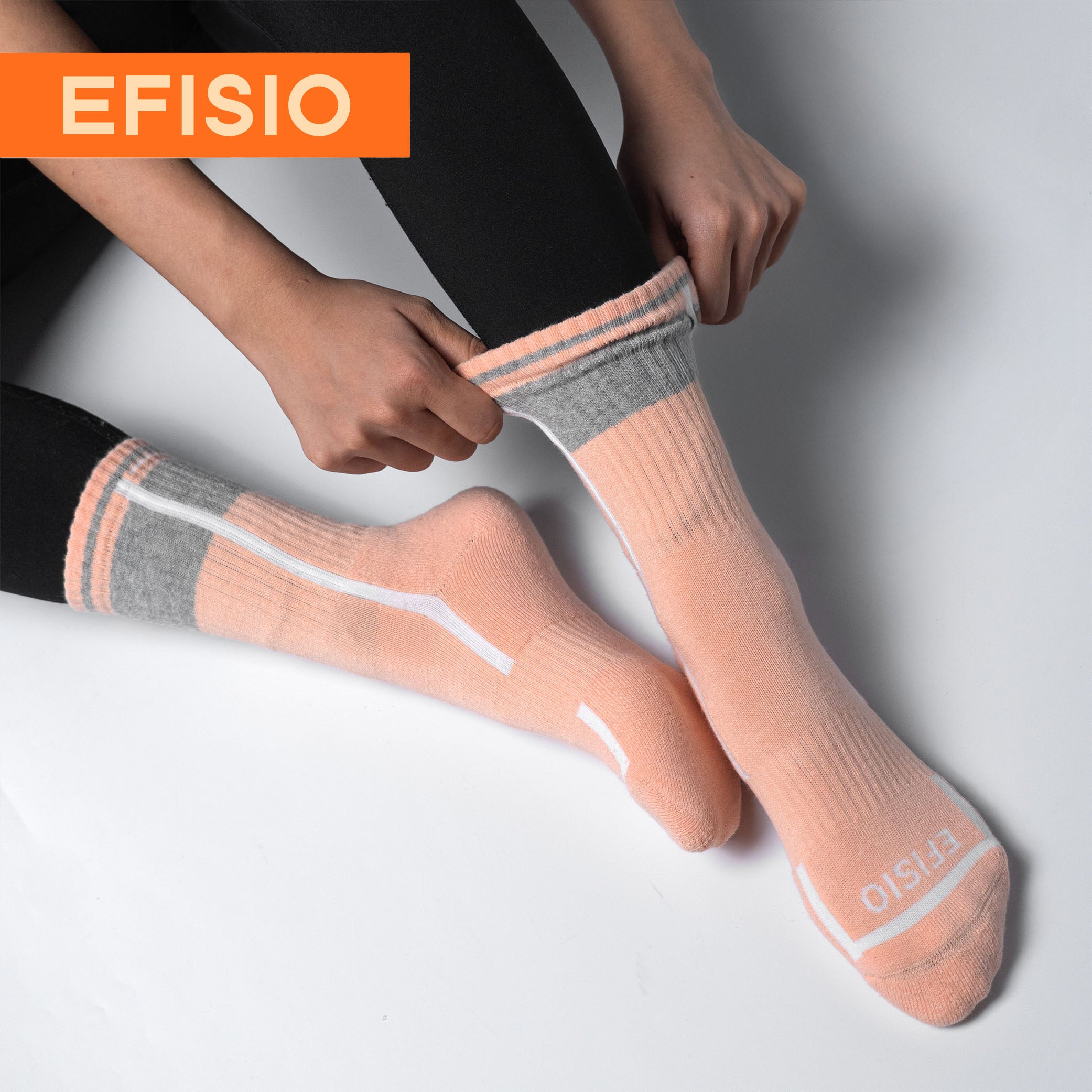 Person wearing pink EFISIO All-Day Running Socks socks with gray accents on a light gray background