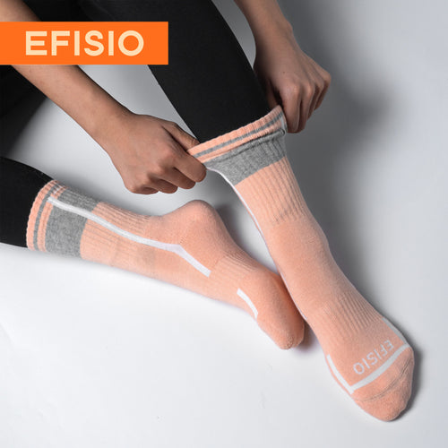 Person wearing pink EFISIO All-Day Running Socks socks with gray accents on a light gray background