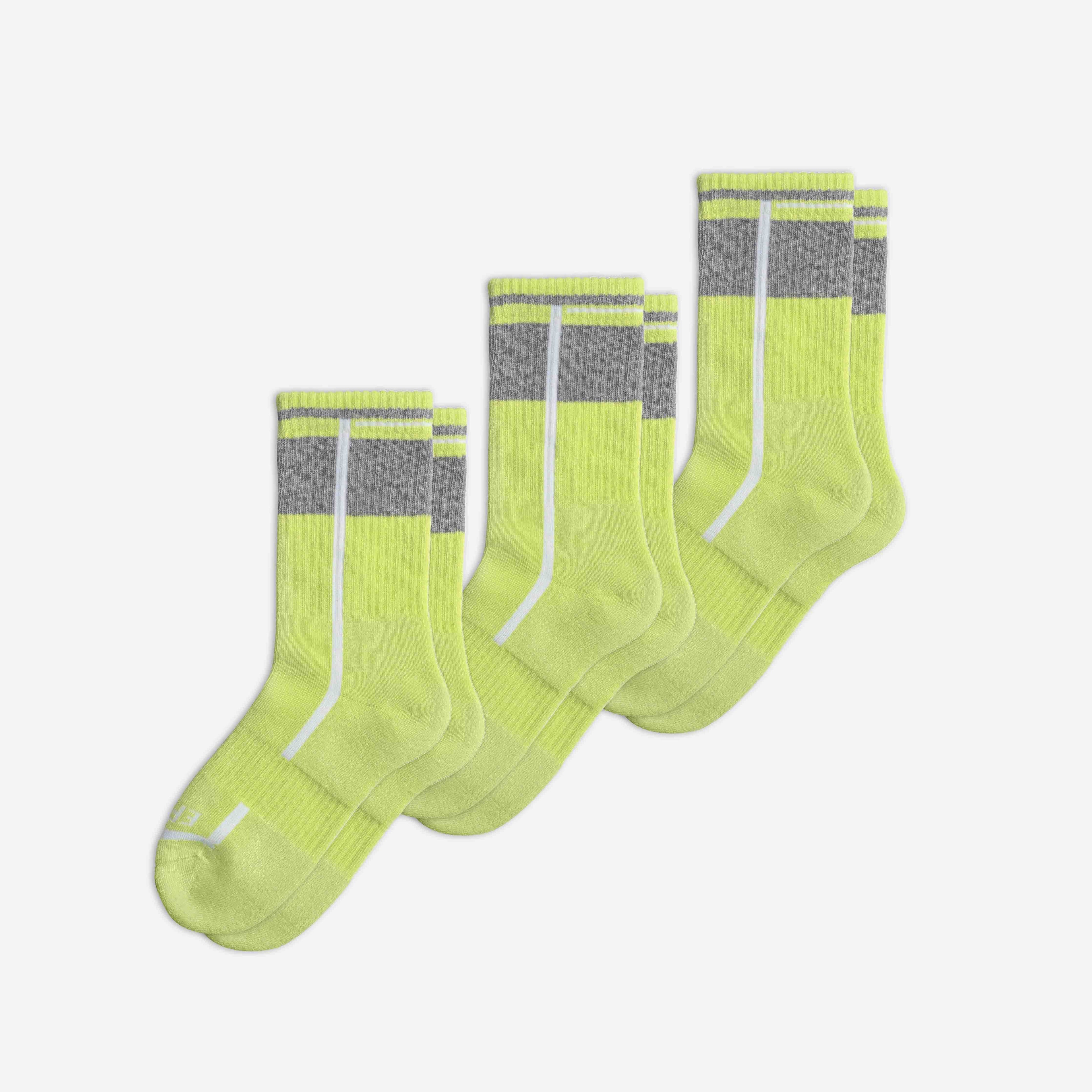 Three pairs of neon green EFISIO All-Day Running Socks with gray accents on a white background