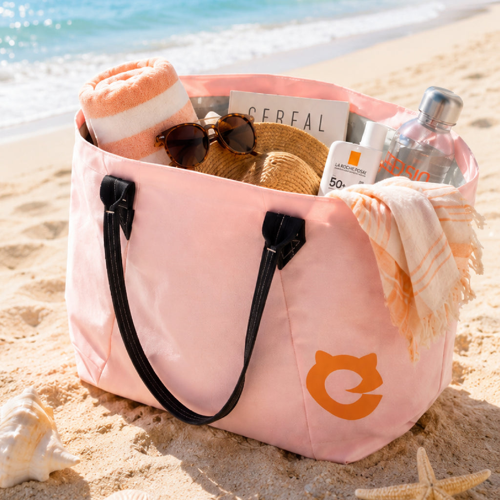 Pink EFISIO Avelina Tote Bag with beach items on a sandy beach