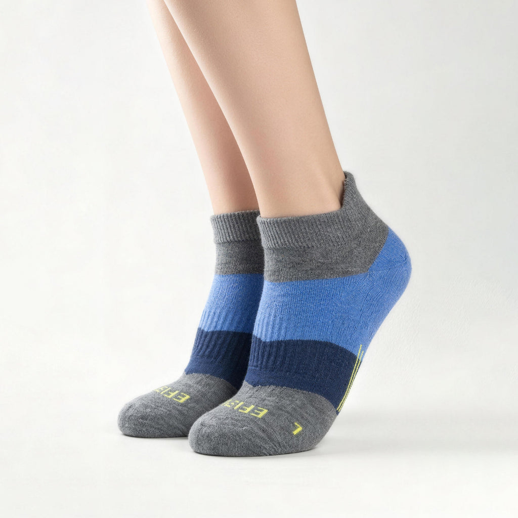 Blue EFISIO Merino Wool Tab socks worn by a person on a white background